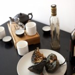 Writing on the Wall / Writing on Fans, live performance, writing with charcoal on an insignificant wall and on paper fans, 2012